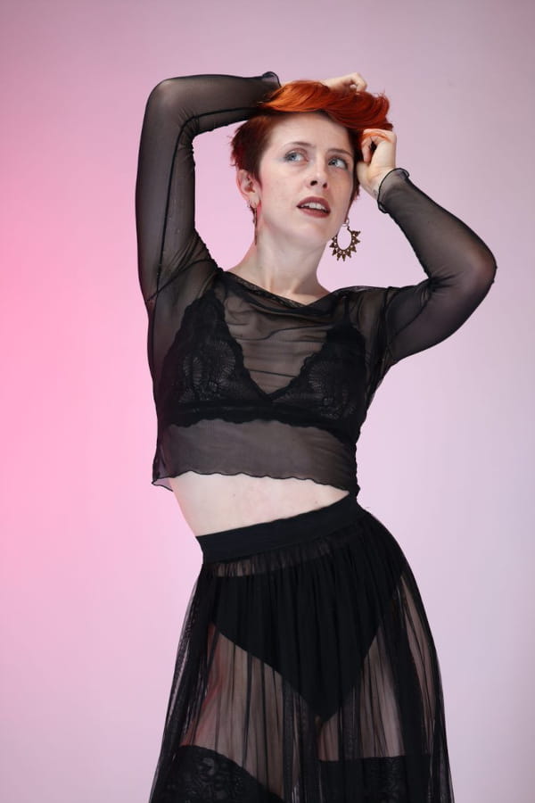 Portrait of Scarlet Siren in black stylish dress